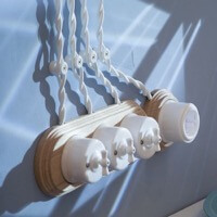 Блок из трех выключателей с рамкой на три поста и розетка с рамкой на один пост Лизетта, Керамика,  Цвет: Белый, Цвет рамки: Натурель.